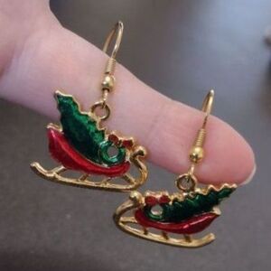 Gold tone holiday sleigh earrings red green
